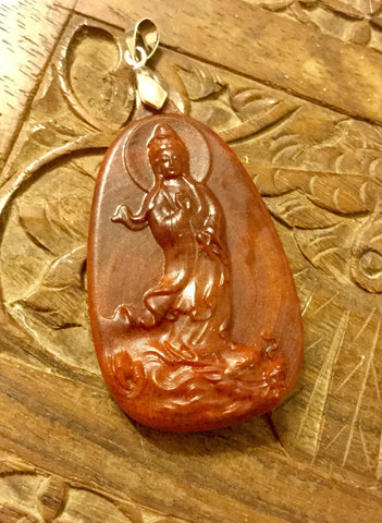 Raja Kayu engraved Kuan Yin riding on Dragon pendant